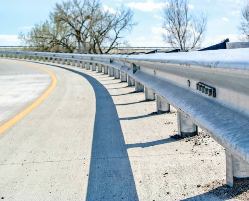W-Beam guardrail installation by Ideal Fencing Corp